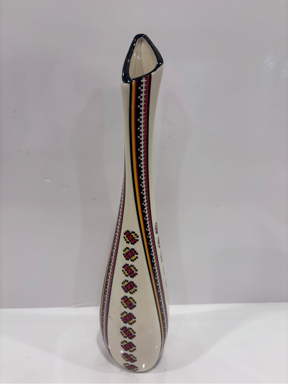 Tall studio pottery vase with folk art embroidery pattern -11”